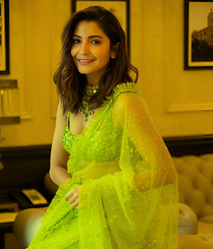 Anushka Sharma is wearing a green color dress
